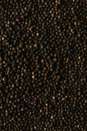 pexels-photo-5988689-5988689 Detailed close-up of black peppercorns showcasing texture and spice quality.