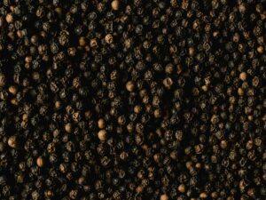 Detailed close-up of black peppercorns showcasing texture and spice quality.